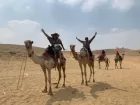 Camel ride at Giza Pyramids during a Cairo day tour with panoramic views
